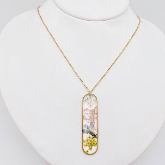 Collier à breloques longues en forme d'ellipse à fleurs séchées